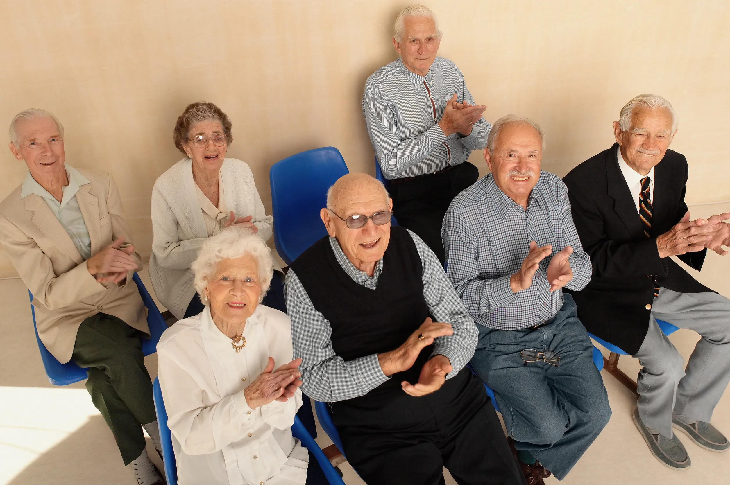 Elderly people looking up applauding Elderly people looking up applauding